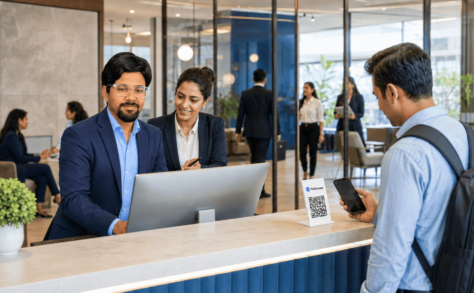 Hotel staff reviewing arrival information together at a reception workstation